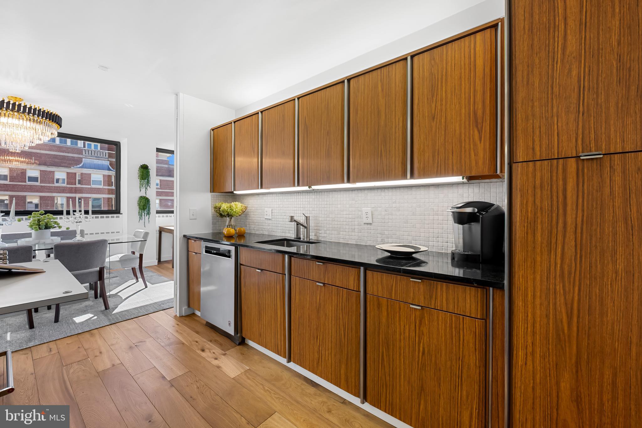 4000 North Charles Street, Unit 1414 Baltimore, MD 21218 - Photo 8 of 45 a kitchen with stainless steel appliances granite countertop a sink and cabinets