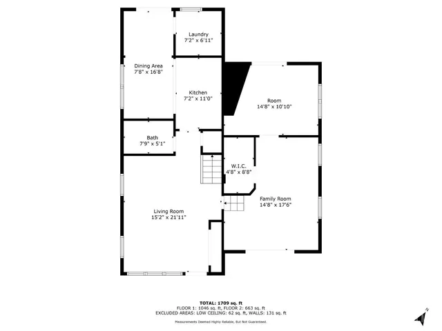 a picture of a bench in front of a wall