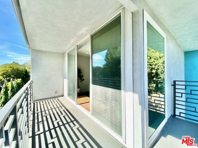 a view of balcony with wooden floor