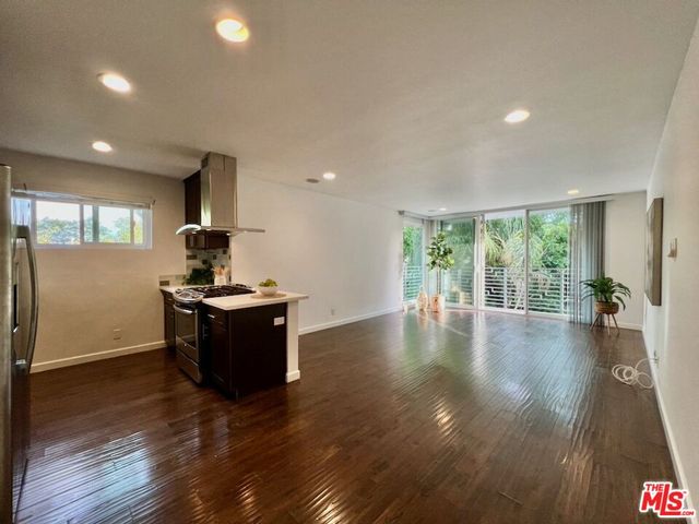 a kitchen with a table and chairs in it