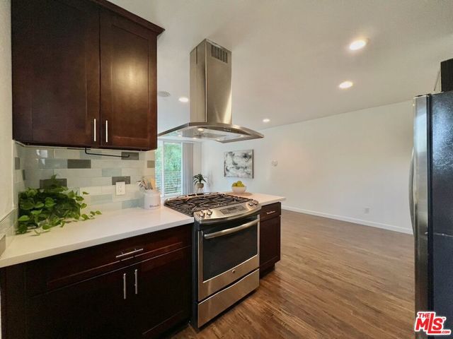 a kitchen with a stove and a sink