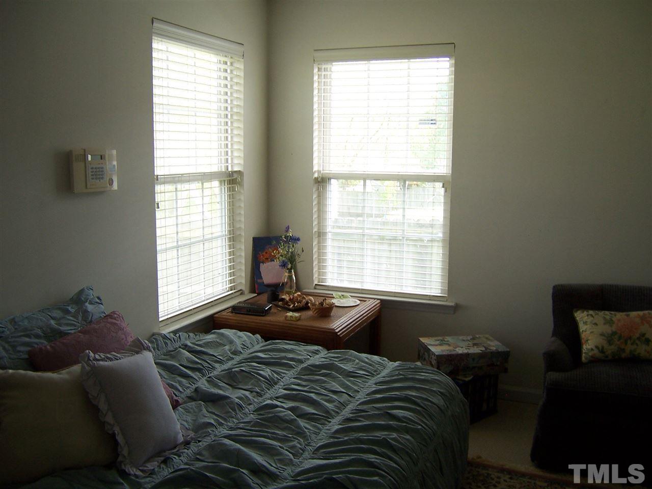 4948 Silverdene Street Raleigh, NC 27616 - Photo 14 of 20 a bedroom with a bed and a window