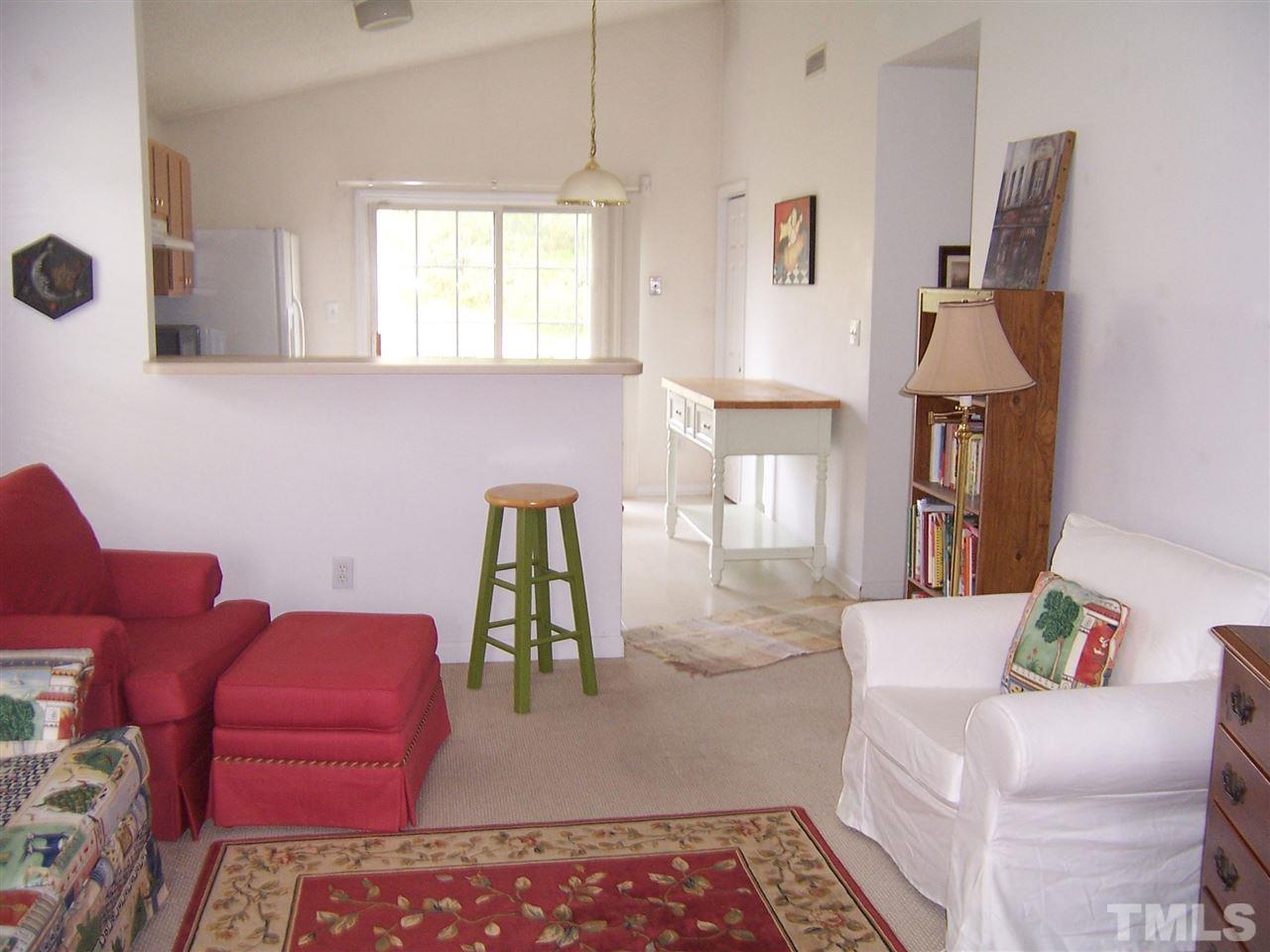 4948 Silverdene Street Raleigh, NC 27616 - Photo 8 of 20 a living room with furniture and a window