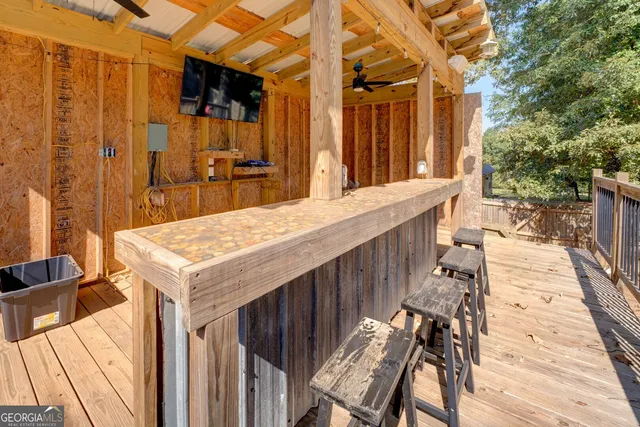 a view of a patio with table and chairs