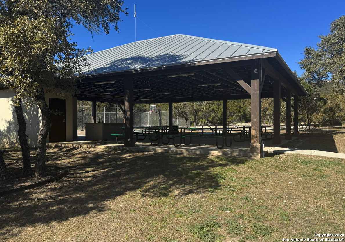 Lot 264 PR 1709 Mico, TX 78056 - Photo 17 of 22 a patio with table and chairs