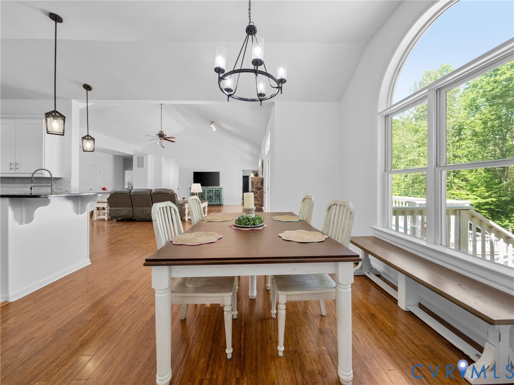 6126 Autumn Bluff Road Powhatan, VA 23139 - Photo 21 of 47 a view of a dining room with furniture window and wooden floor