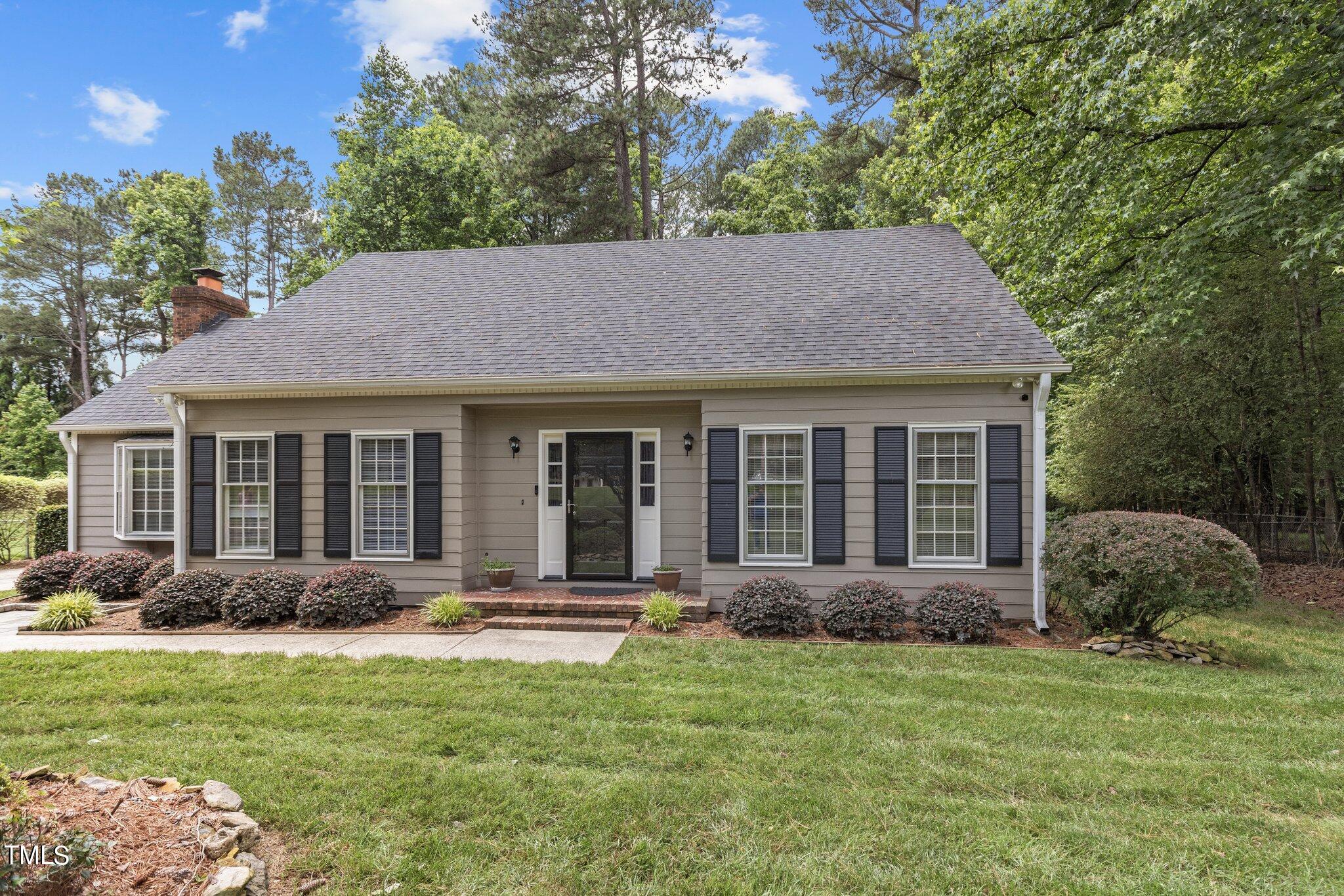 5125 Russell Road Durham, NC 27712 - Photo 1 of 59 a view of a house with a yard and plants