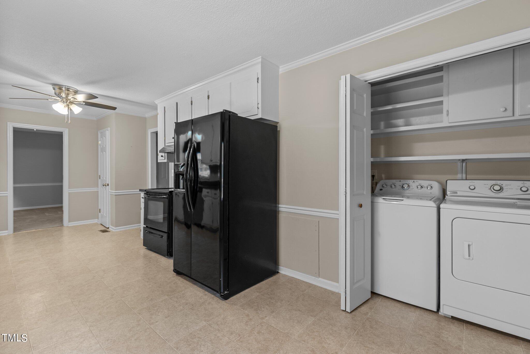 5125 Russell Road Durham, NC 27712 - Photo 17 of 59 a view of a storage & utility room with washer and dryer