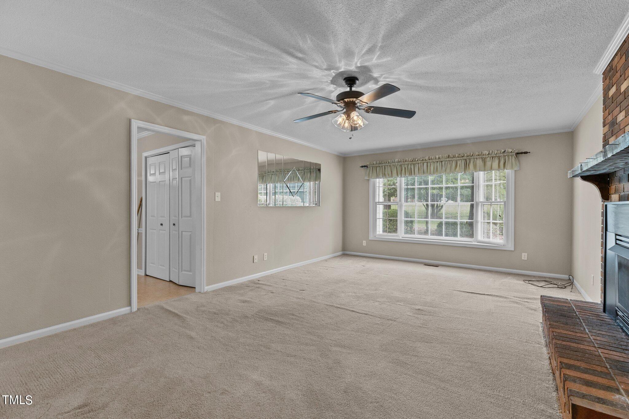 5125 Russell Road Durham, NC 27712 - Photo 22 of 59 a view of an empty room with a window