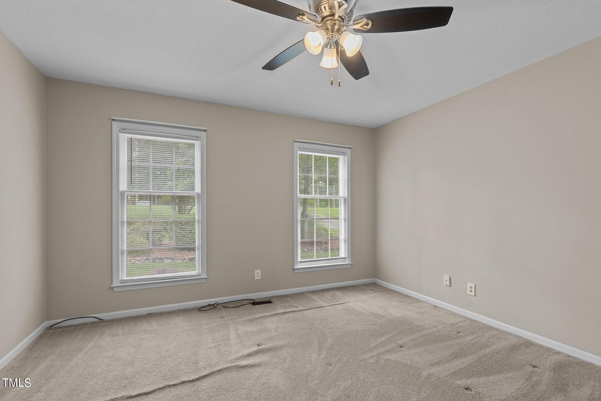 5125 Russell Road Durham, NC 27712 - Photo 26 of 59 a view of an empty room with a window