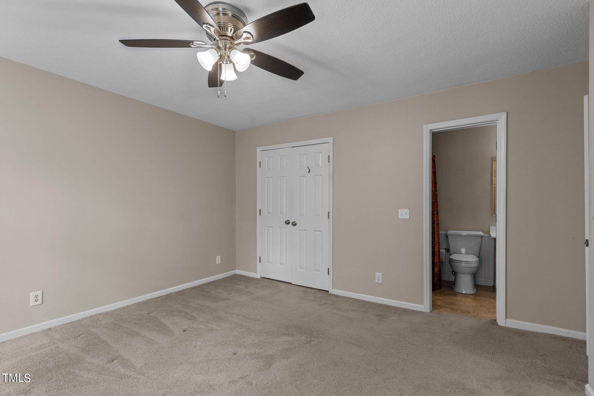 5125 Russell Road Durham, NC 27712 - Photo 27 of 59 a view of an empty room and chandelier fan