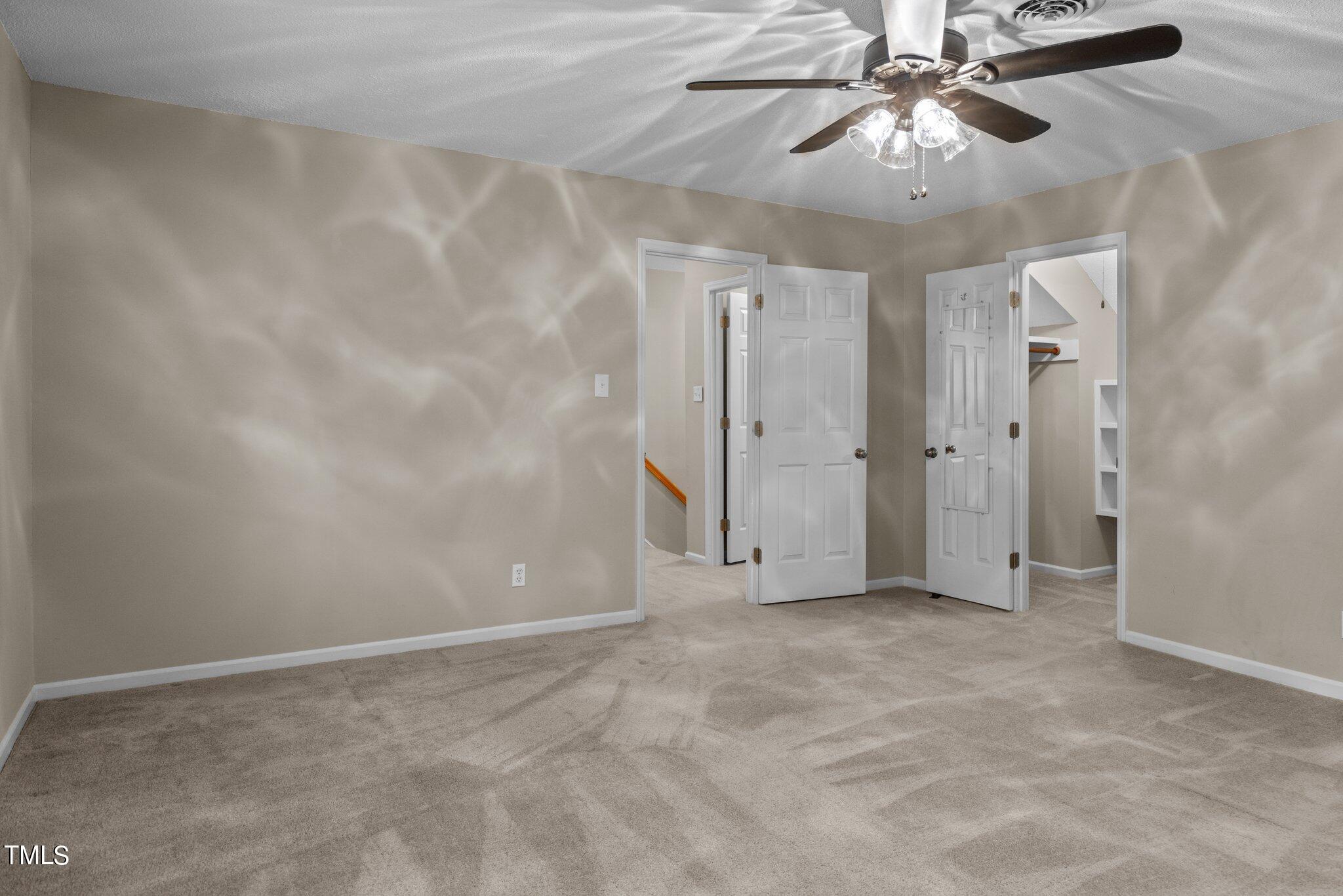 5125 Russell Road Durham, NC 27712 - Photo 31 of 59 an empty room with chandelier fan