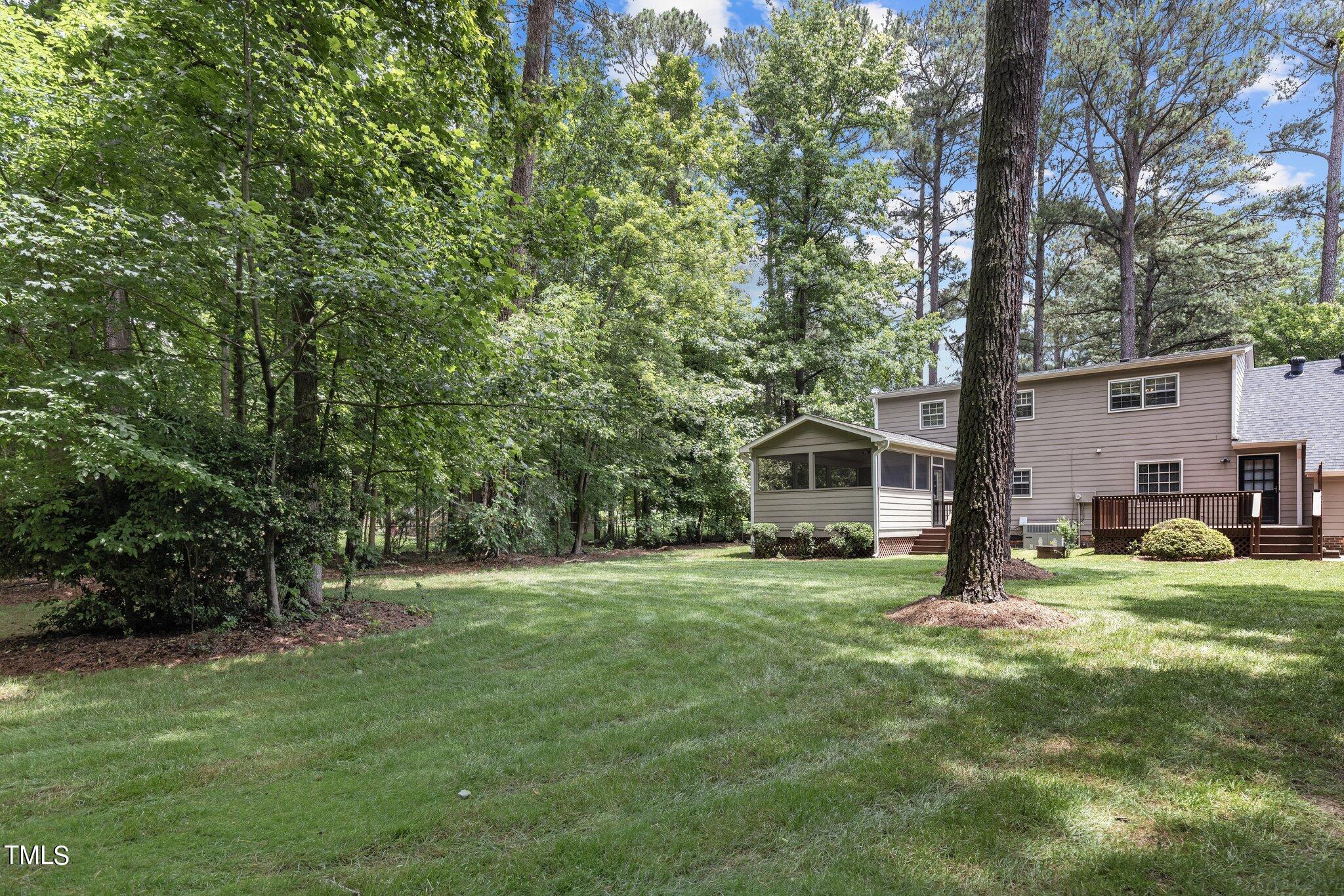 5125 Russell Road Durham, NC 27712 - Photo 45 of 59 a big yard with large trees and plants
