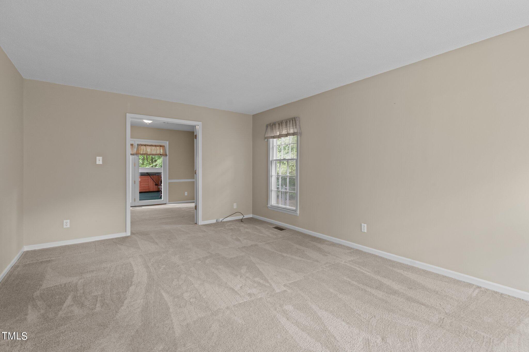5125 Russell Road Durham, NC 27712 - Photo 5 of 59 an empty room with windows and closet