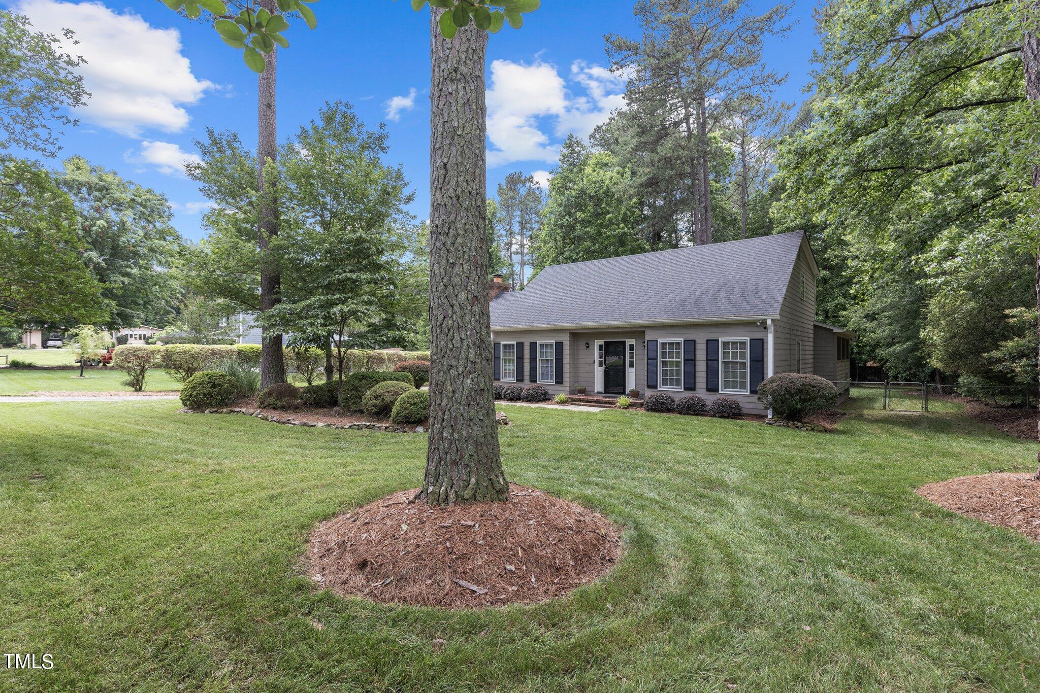 5125 Russell Road Durham, NC 27712 - Photo 51 of 59 a front view of a house with a yard