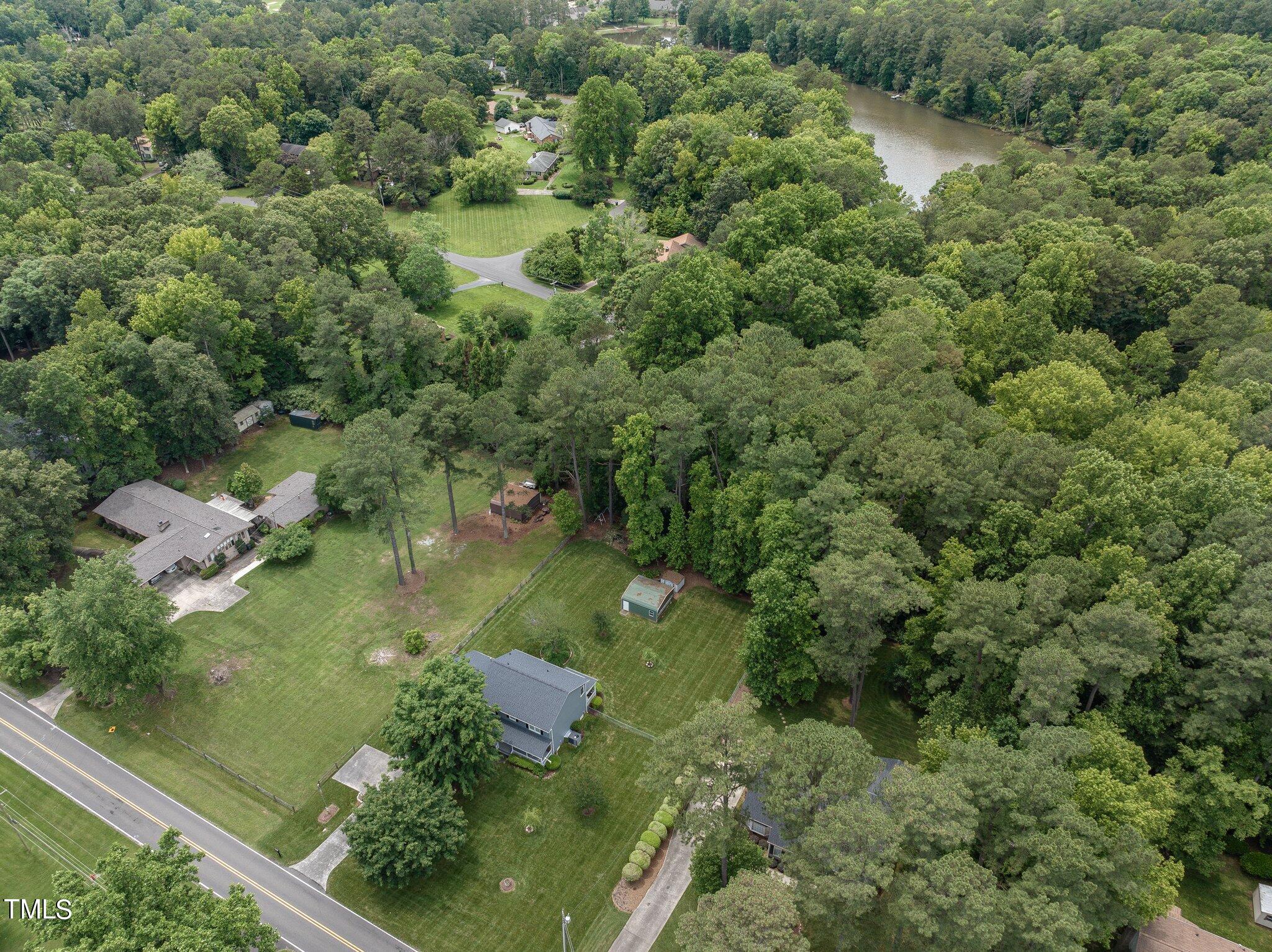 5125 Russell Road Durham, NC 27712 - Photo 59 of 59 an aerial view of residential houses with outdoor space and trees all around