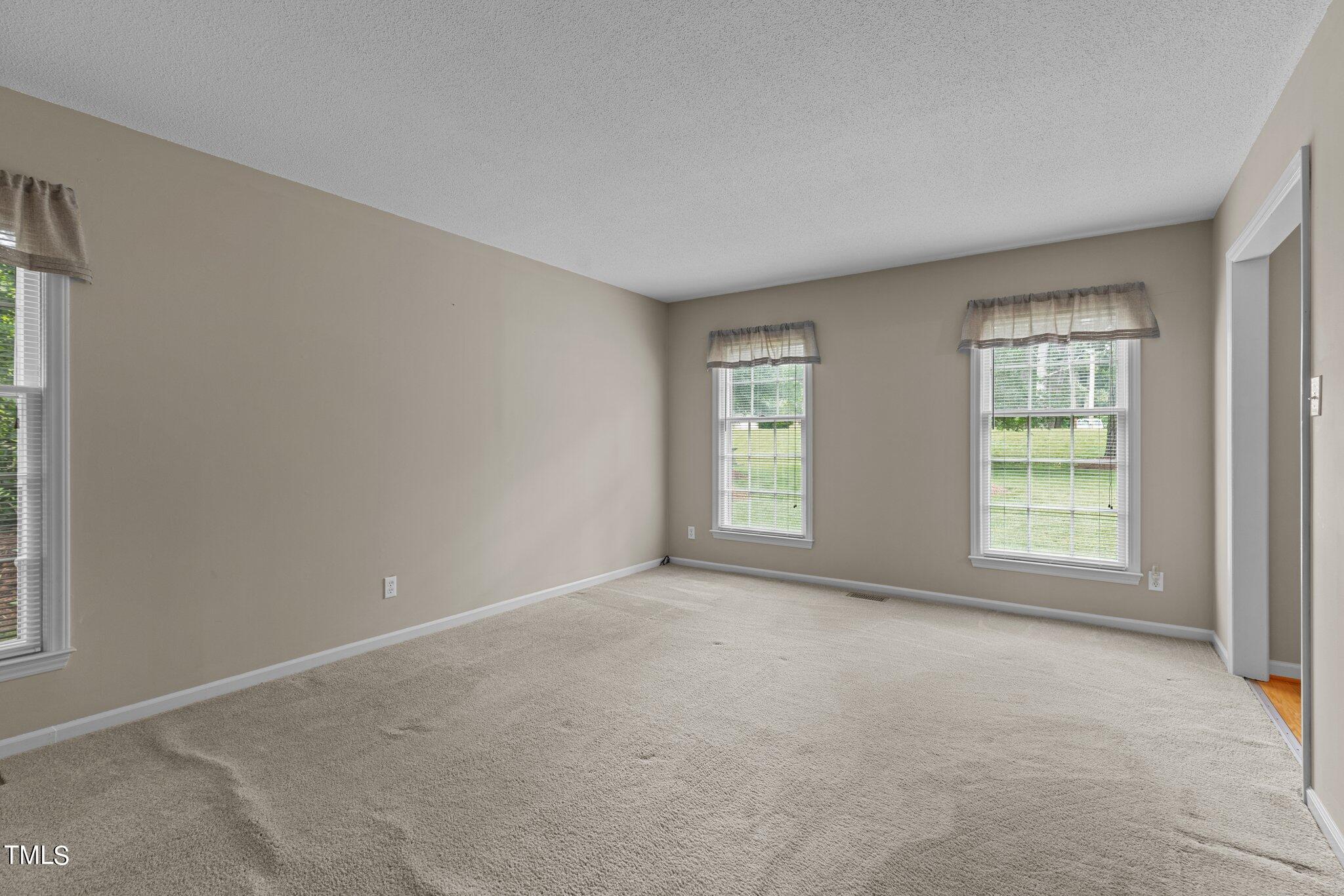 5125 Russell Road Durham, NC 27712 - Photo 6 of 59 an empty room with windows