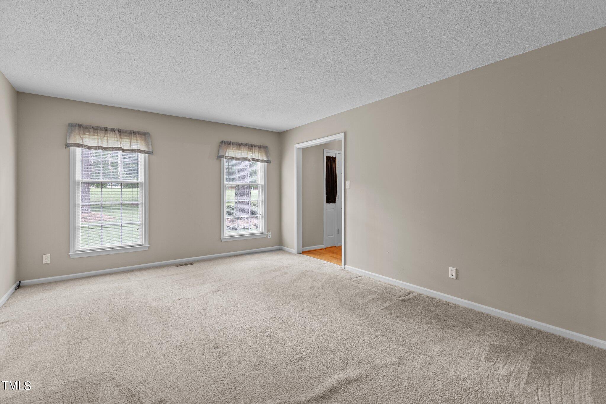 5125 Russell Road Durham, NC 27712 - Photo 7 of 59 an empty room with windows and closet