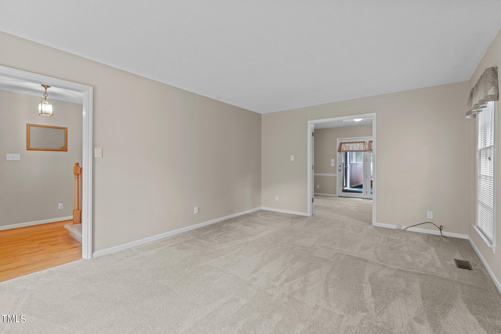 5125 Russell Road Durham, NC 27712 - Photo 8 of 59 a view of an empty room with closet and a window