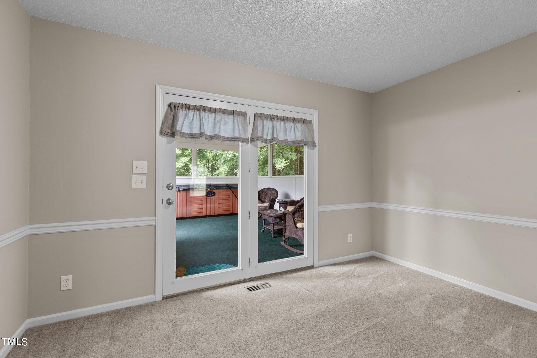 5125 Russell Road Durham, NC 27712 - Photo 9 of 59 an empty room with windows and natural view