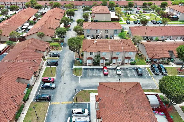 an aerial view of residential houses and outdoor space