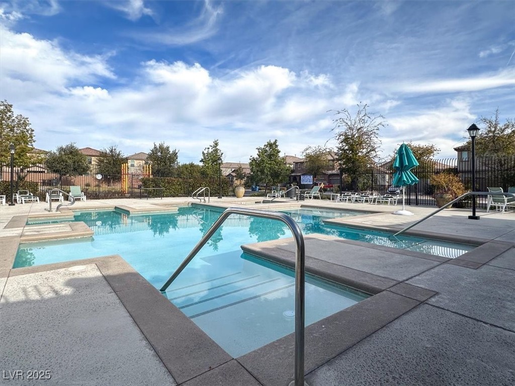 9236 Keystone Ridge Avenue Las Vegas, NV 89148 - Photo 38 of 38 Community pool featuring a patio and a jacuzzi