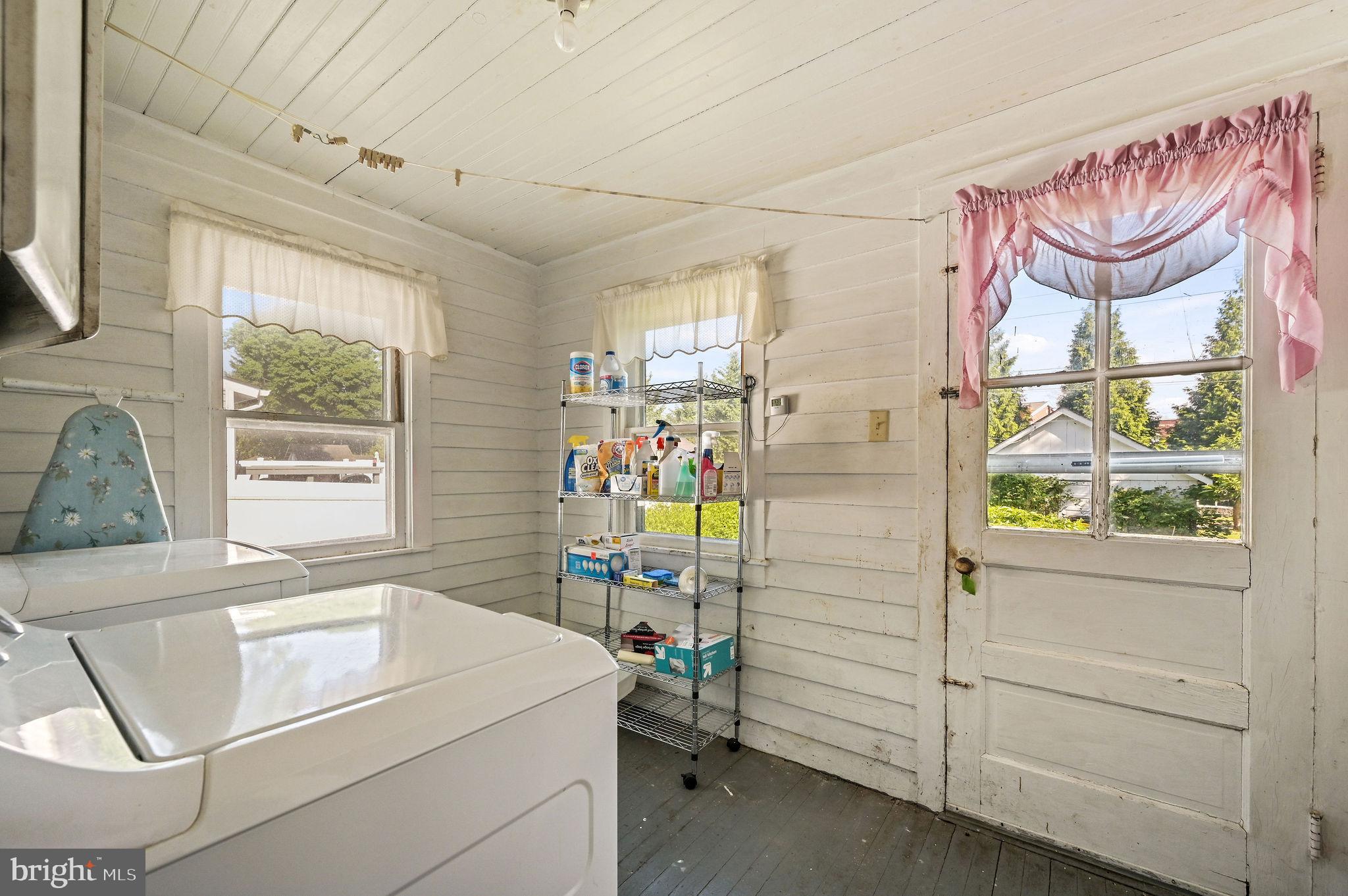 135 Pine Street Dover, DE 19901 - Photo 13 of 27 a utility room with dryer washer and a window