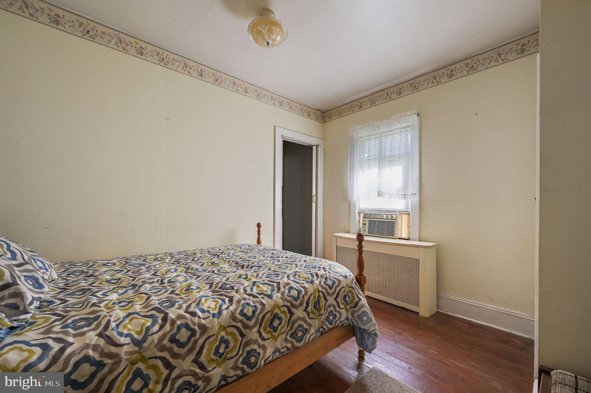 135 Pine Street Dover, DE 19901 - Photo 17 of 27 a bedroom with a bed and a window