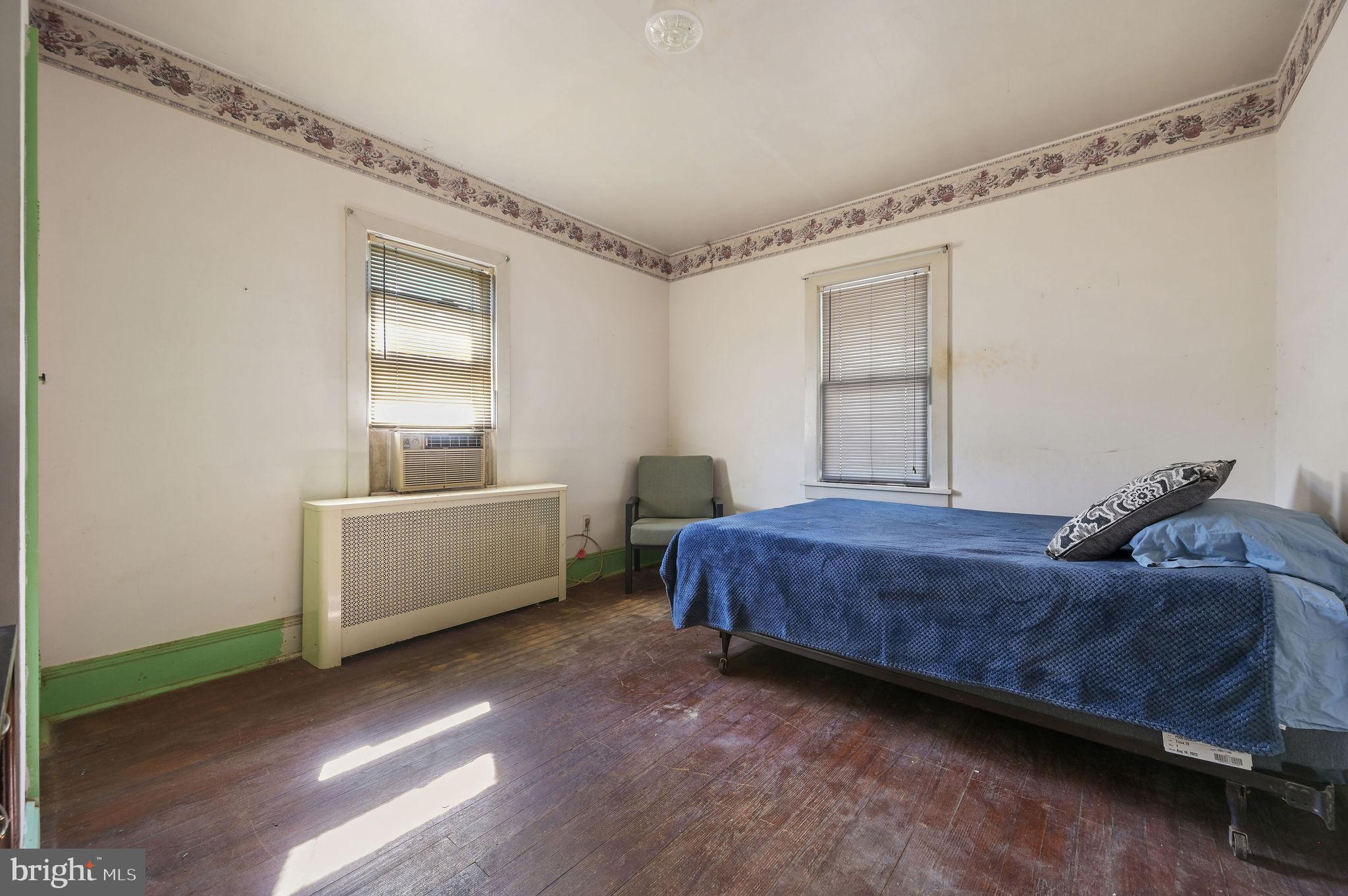 135 Pine Street Dover, DE 19901 - Photo 19 of 27 a bedroom with a bed and a window