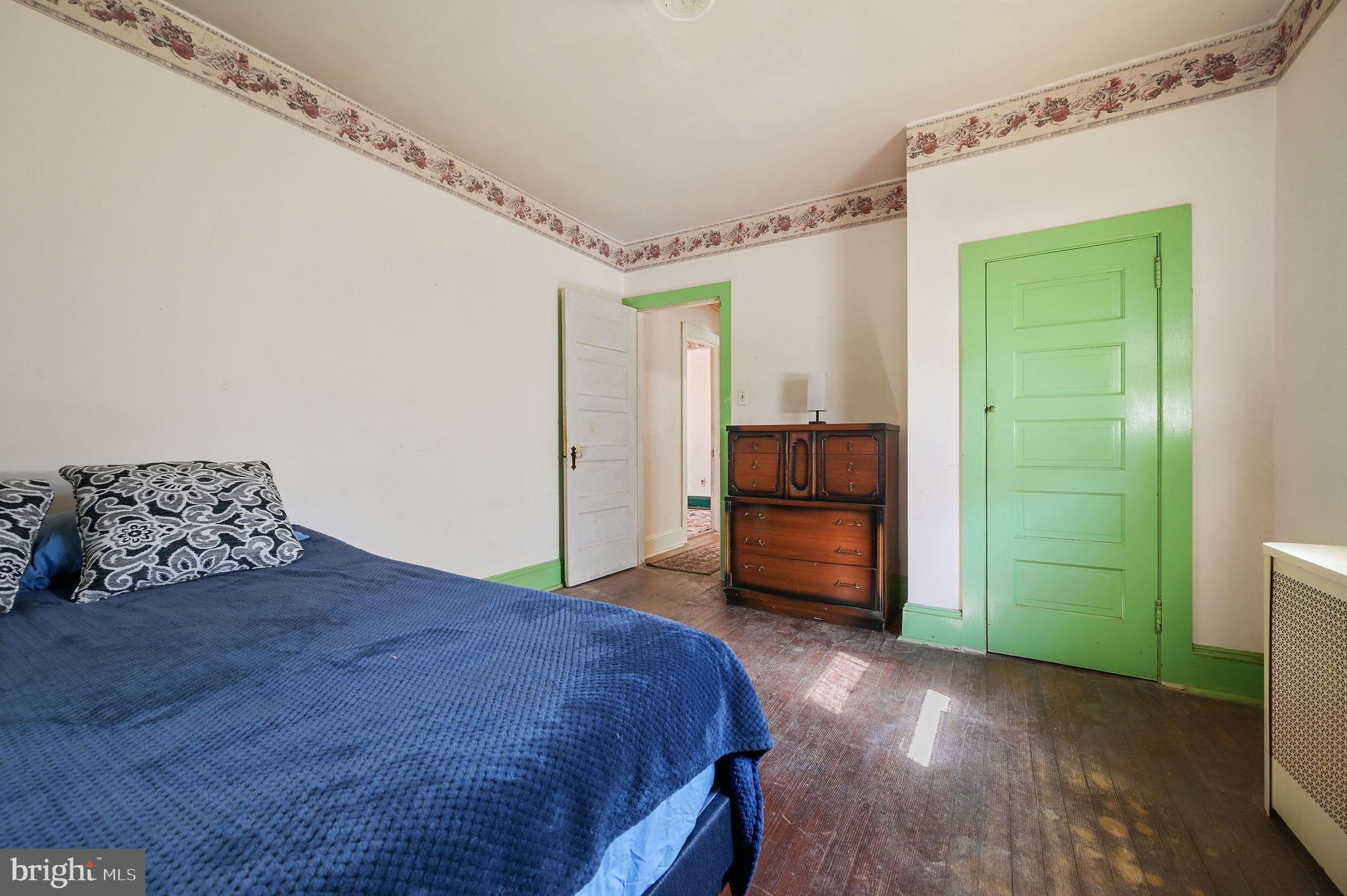 135 Pine Street Dover, DE 19901 - Photo 20 of 27 a bedroom with a bed and a view of bathroom