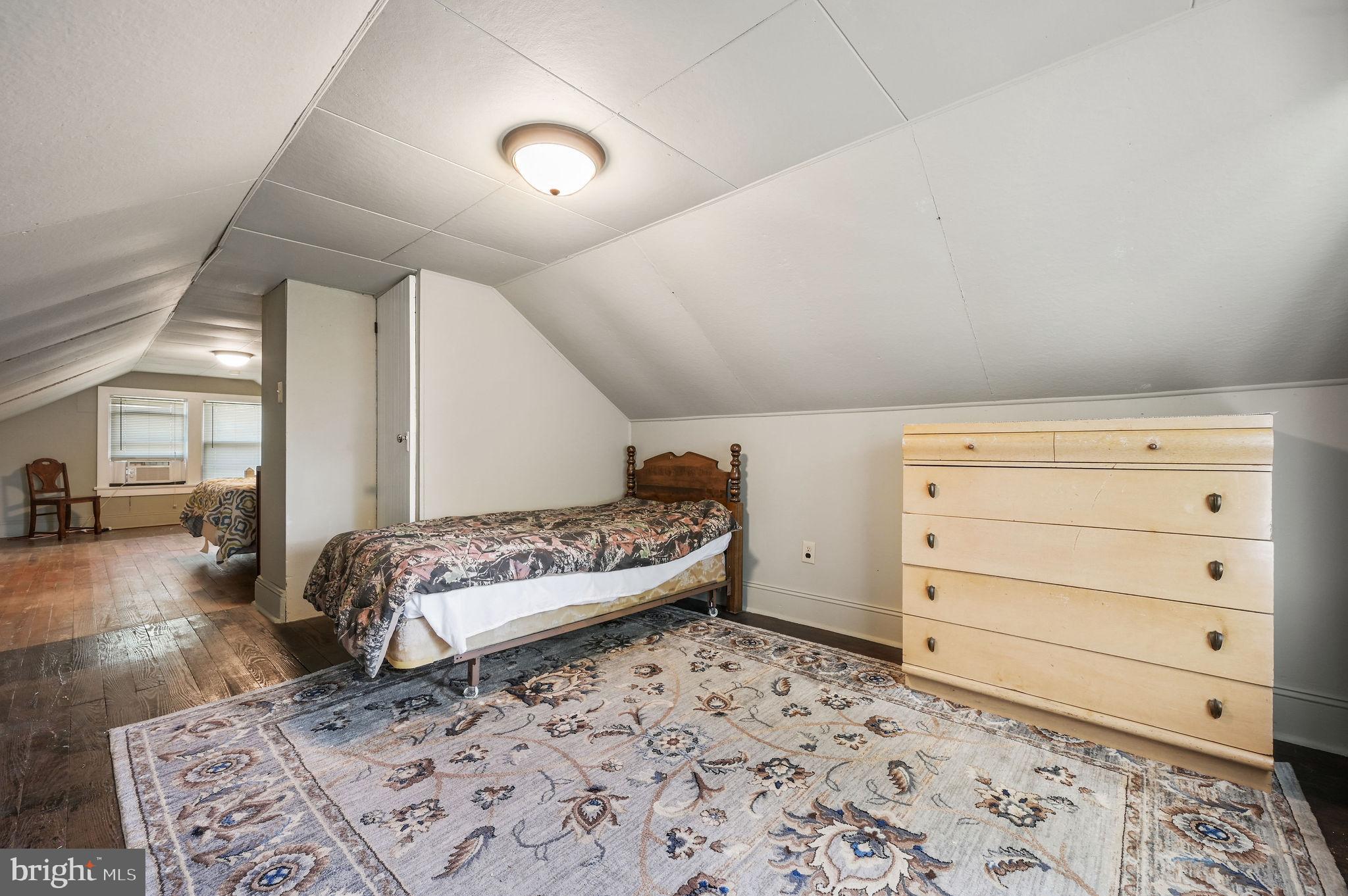 135 Pine Street Dover, DE 19901 - Photo 22 of 27 a living room with a couch and a dresser