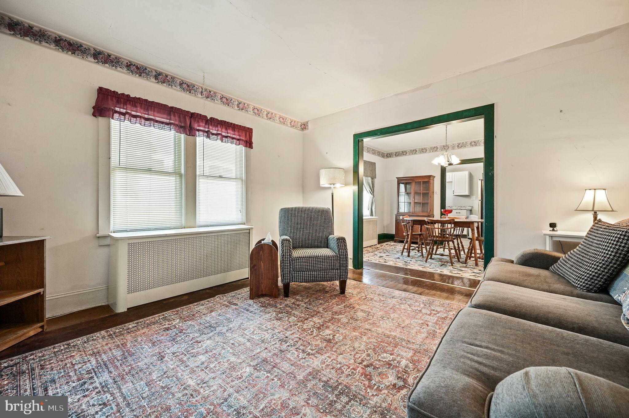 135 Pine Street Dover, DE 19901 - Photo 4 of 27 a living room with furniture and a window
