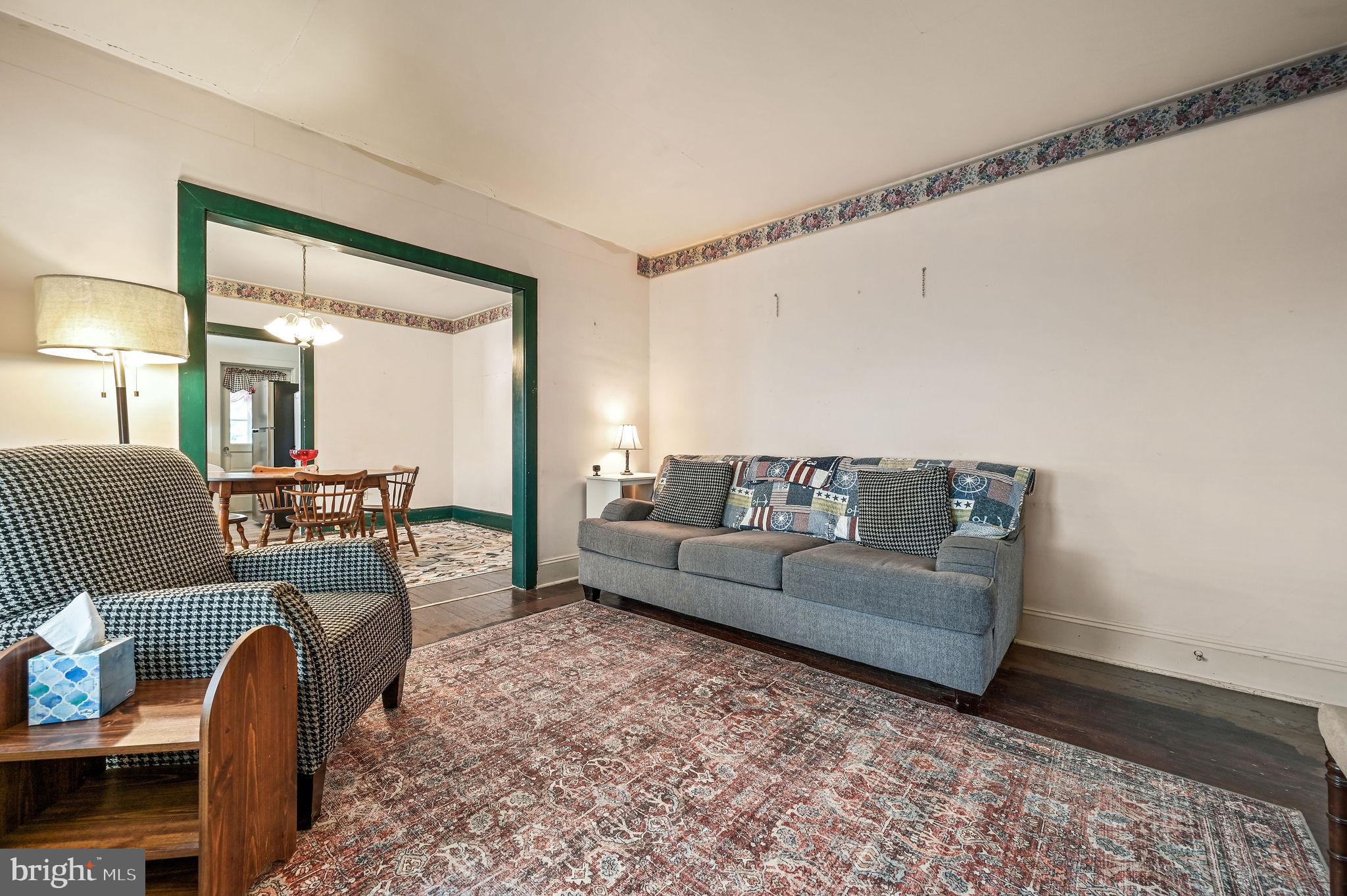 135 Pine Street Dover, DE 19901 - Photo 5 of 27 a living room with furniture and a fireplace