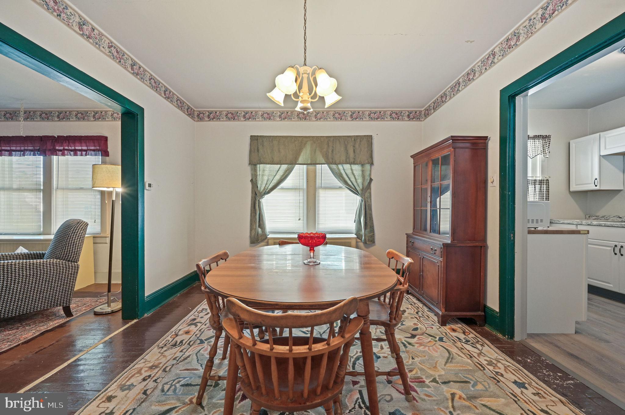135 Pine Street Dover, DE 19901 - Photo 8 of 27 a view of a dining room with furniture window and wooden floor