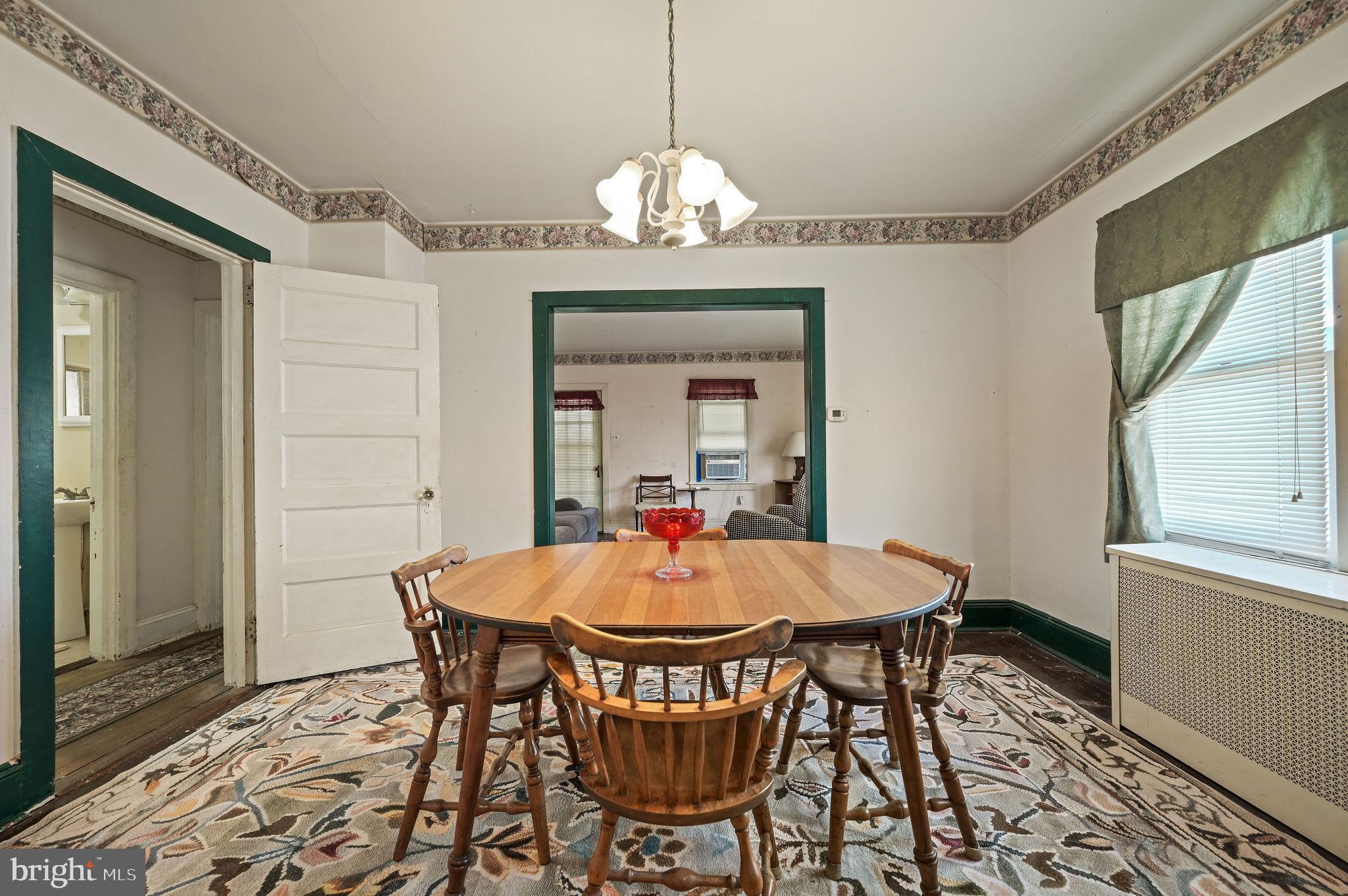 135 Pine Street Dover, DE 19901 - Photo 9 of 27 a dining room with a wooden table and chairs