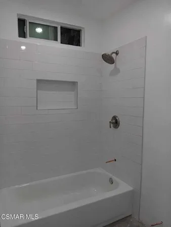 a bathroom with a bathtub