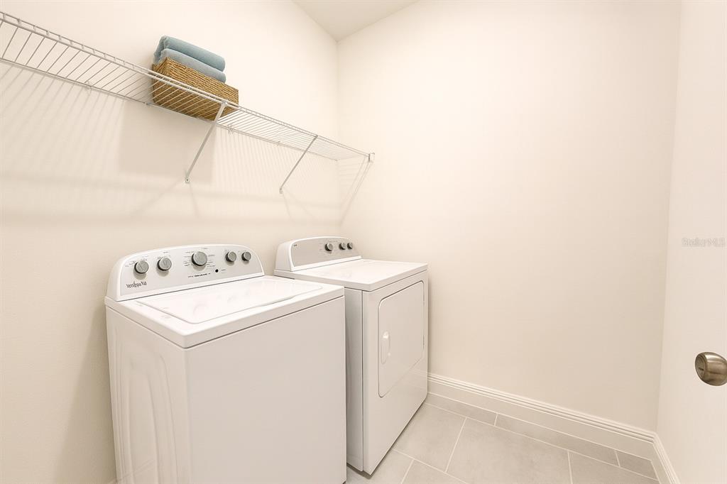 1193 Cavender Creek Road Minneola, FL 34715 - Photo 19 of 22 a utility room with dryer and washer