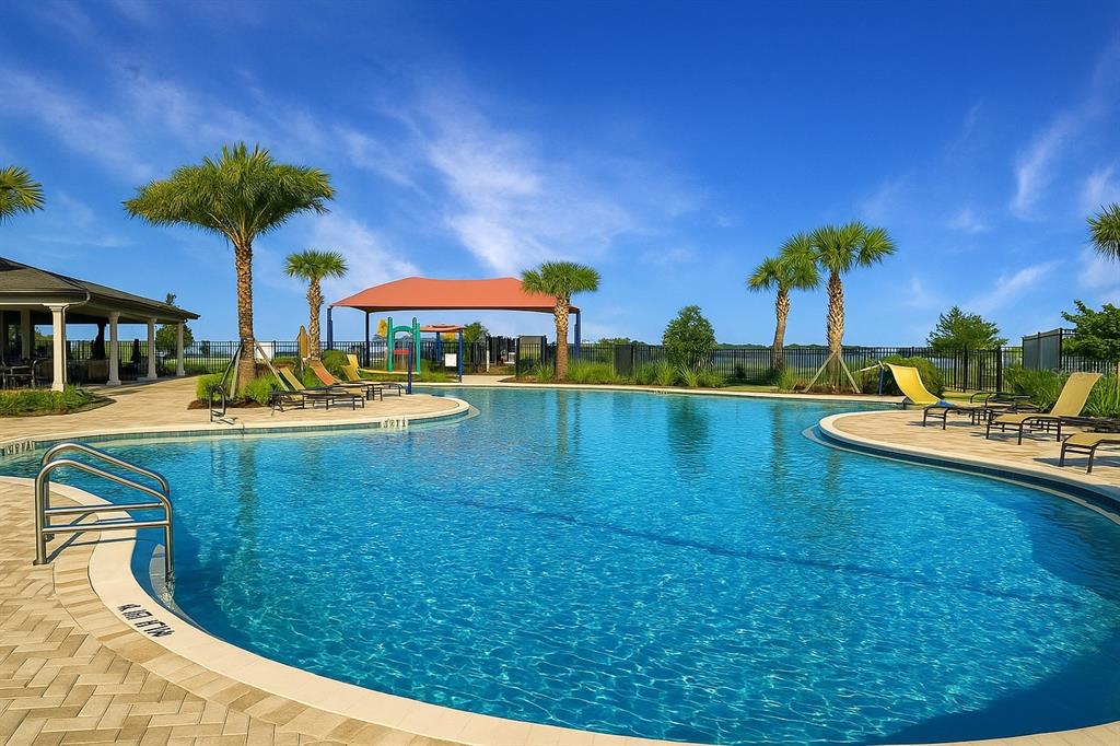 1193 Cavender Creek Road Minneola, FL 34715 - Photo 3 of 22 a view of a swimming pool with a garden