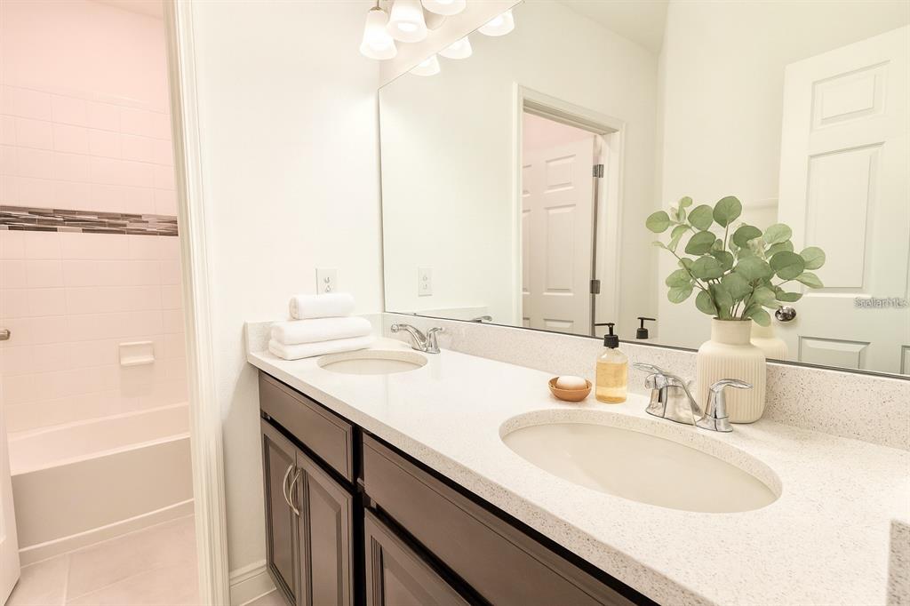 1193 Cavender Creek Road Minneola, FL 34715 - Photo 10 of 22 a bathroom with a sink and a mirror