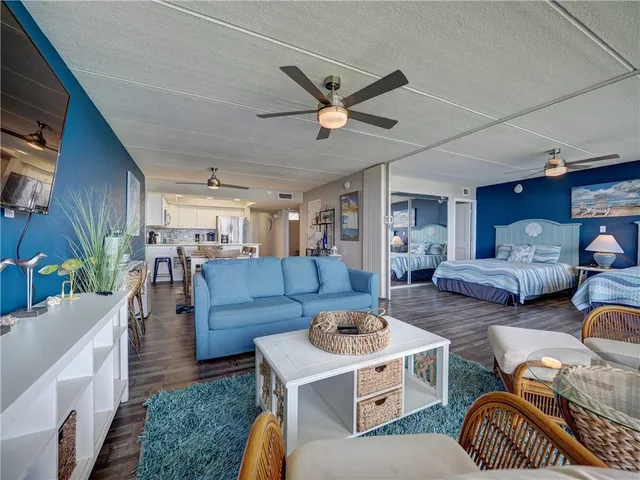 a living room with furniture and a clock