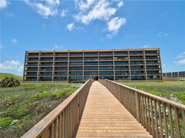 a view of balcony with wooden floor and lake view