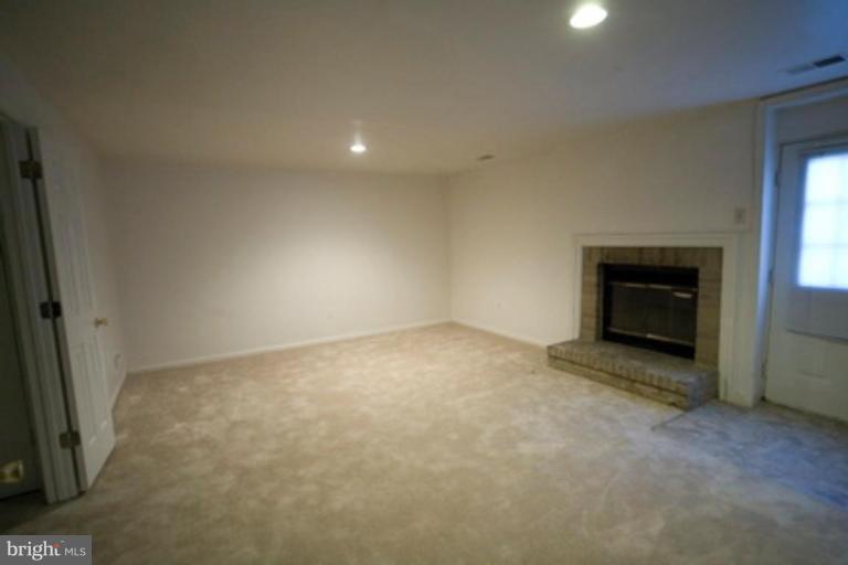 617 Concerto Lane Silver Spring, MD 20901 - Photo 16 of 17 Basement with fireplace