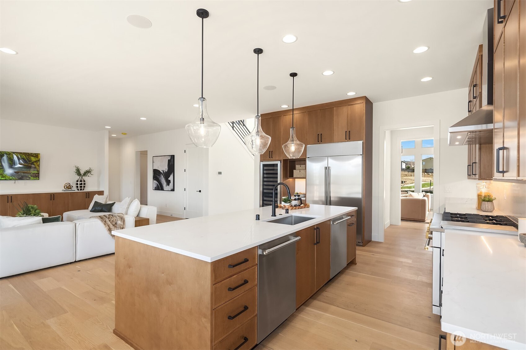 510 Nile Avenue Northeast Renton, WA 98059 - Photo 12 of 40 a large kitchen with stainless steel appliances kitchen island a large counter top a sink a stove and a center island