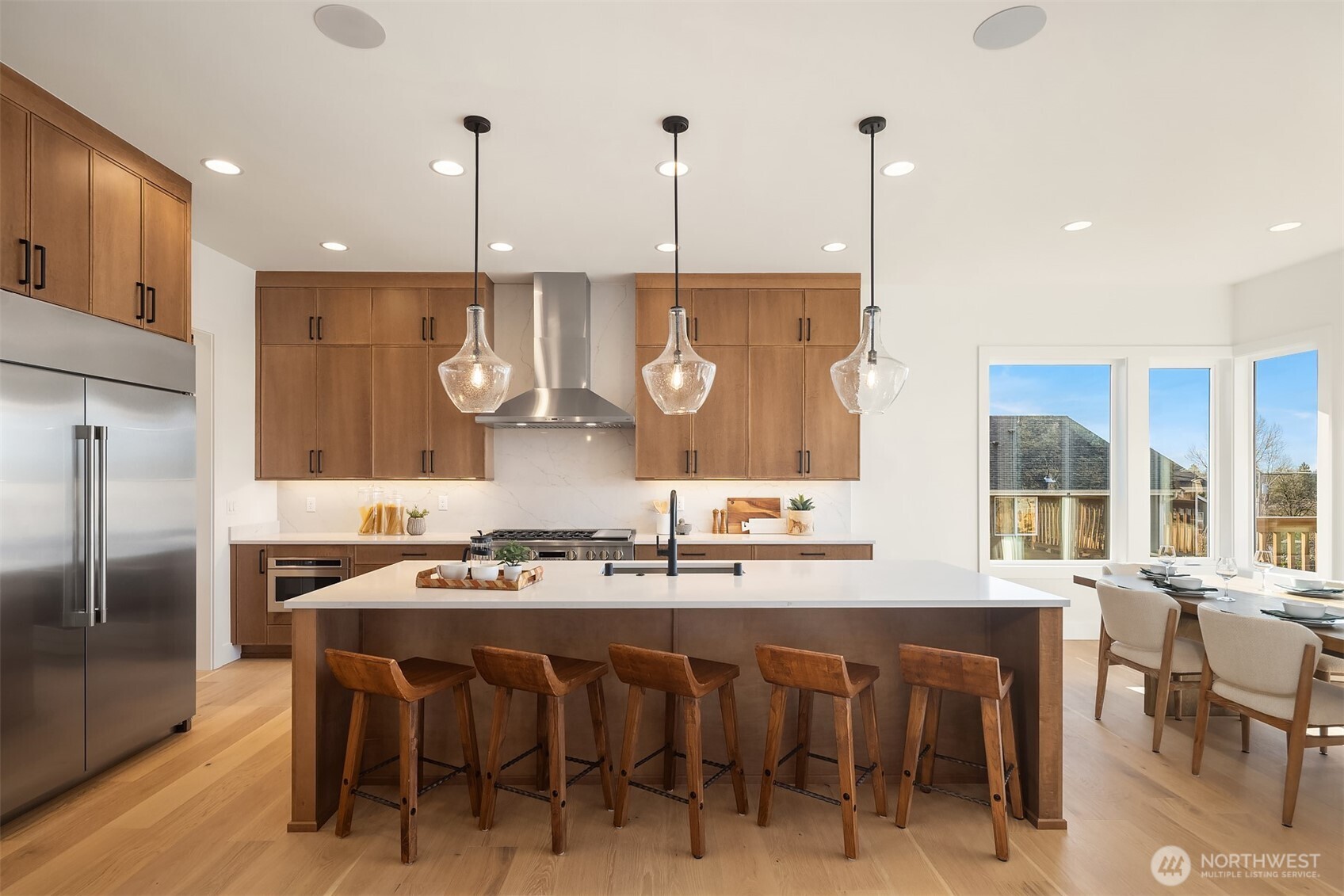 510 Nile Avenue Northeast Renton, WA 98059 - Photo 13 of 40 a kitchen with stainless steel appliances granite countertop a kitchen island a stove and a refrigerator