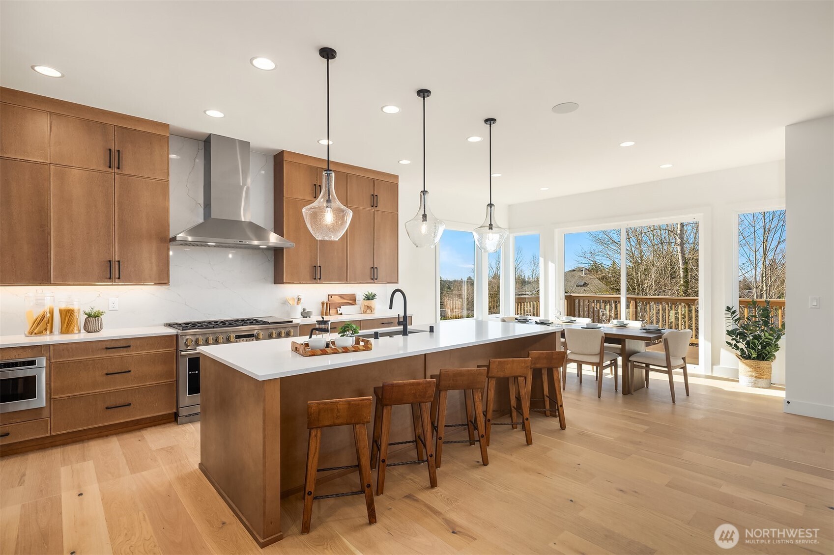 510 Nile Avenue Northeast Renton, WA 98059 - Photo 14 of 40 a large kitchen with lots of counter space a sink appliances and dining table