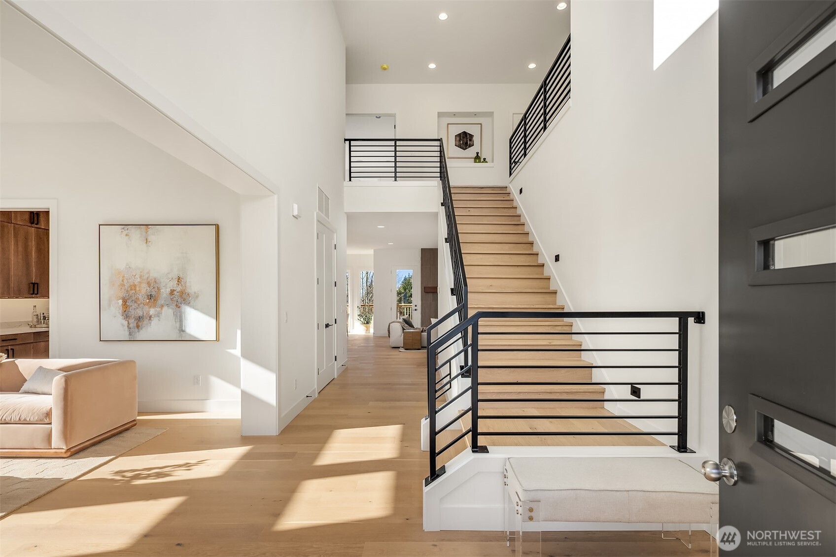 510 Nile Avenue Northeast Renton, WA 98059 - Photo 2 of 40 a view of a hallway with wooden floor and furniture