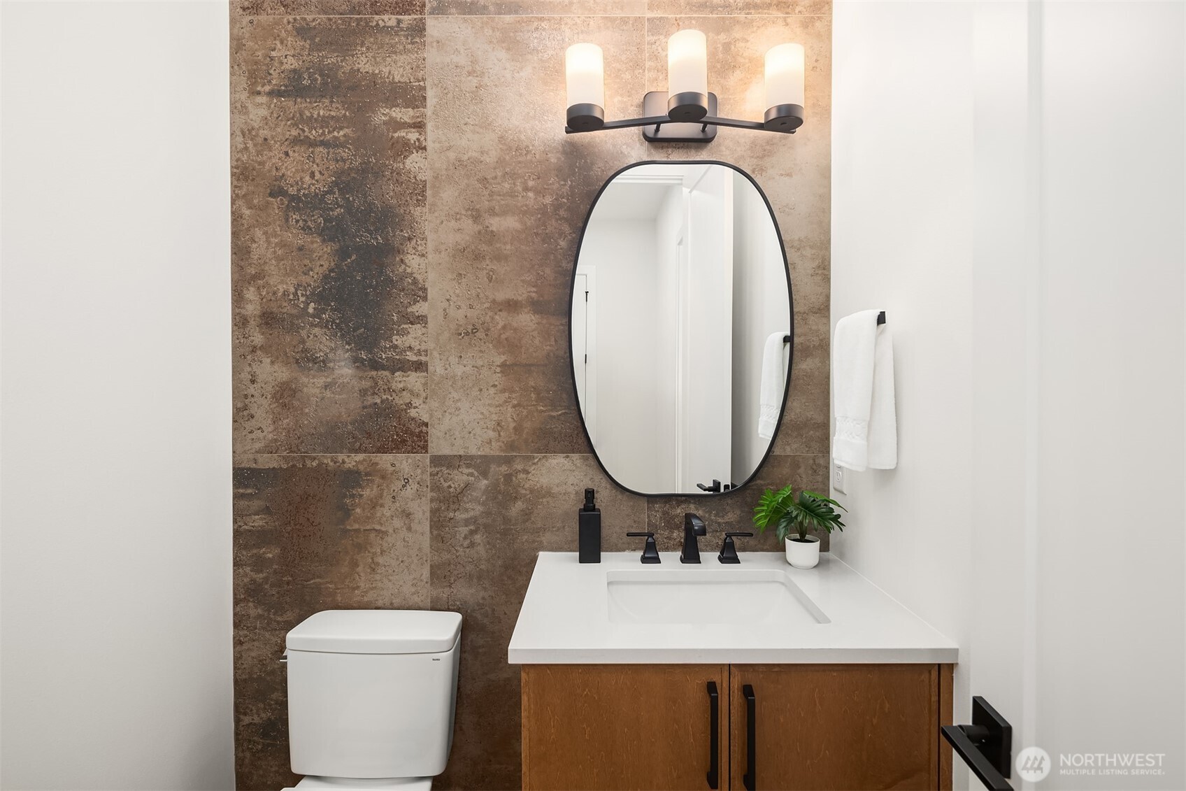 510 Nile Avenue Northeast Renton, WA 98059 - Photo 21 of 40 a bathroom with a toilet a sink and mirror