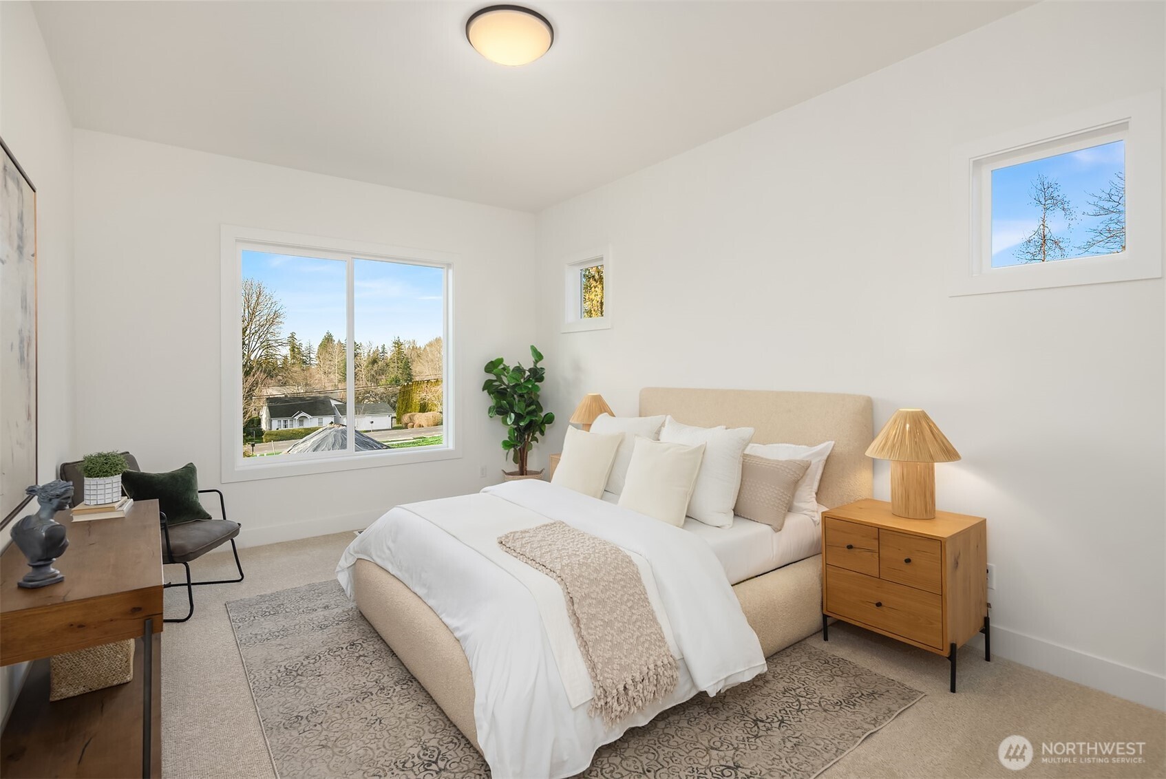510 Nile Avenue Northeast Renton, WA 98059 - Photo 23 of 40 a spacious bedroom with a bed and wooden floor
