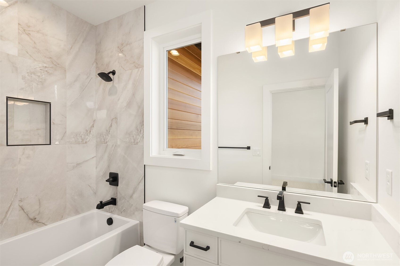 510 Nile Avenue Northeast Renton, WA 98059 - Photo 26 of 40 a bathroom with a sink a toilet and shower