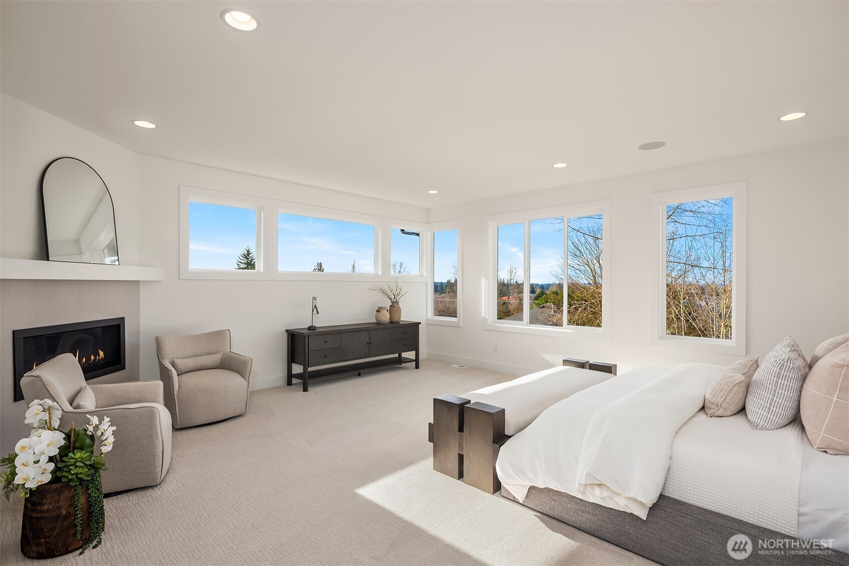 510 Nile Avenue Northeast Renton, WA 98059 - Photo 30 of 40 a spacious bedroom with a bed a couch and dresser